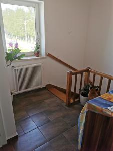 a room with a staircase and a window at Ferienwohnung Solebad in Gmünd