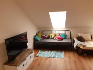 Postel nebo postele na pokoji v ubytování Apartmány na náměstí
