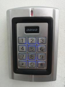 an omg calculator is attached to a wall at Apartamenty Lawendowy Zakątek 2 in Opole