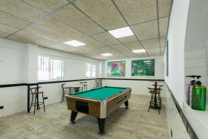 a room with a pool table in it at Ciudad De Vacaciones Cala Montjoi in Roses