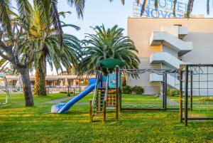 a playground in a park with a slide at Novotel Porto Gaia in Vila Nova de Gaia