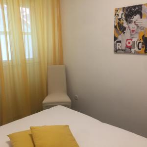 Postel nebo postele na pokoji v ubytování Apartman u srcu grada - Ilićev prolaz