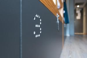 a close up of a door with a paw print on it at Yeah Barcelona Hostel in Barcelona