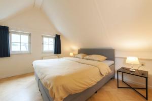 Postel nebo postele na pokoji v ubytování Vakantiehuis Villa 32