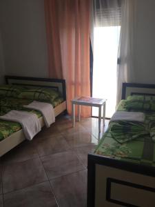 Katil atau katil-katil dalam bilik di Tafilaj Apartments