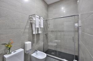 Koupelna v ubytování Porto Domus Hotel