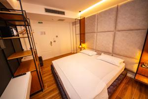 a bedroom with a bed and a bunk bed at Inada Hotel Ksamil in Ksamil