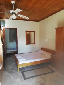 Postel nebo postele na pokoji v ubytování Kastraki Villas