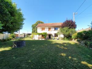 a large yard in front of a house at Au bon Vivant in Dampierre-sur-Salon