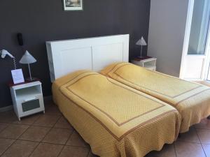 Postel nebo postele na pokoji v ubytování L'ilot Fleuri