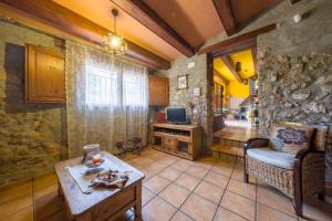 Posezení v ubytování Casa rural lo Maset de Carmeta + 22 fotografií