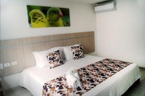 Postel nebo postele na pokoji v ubytování Hotel Cafeira