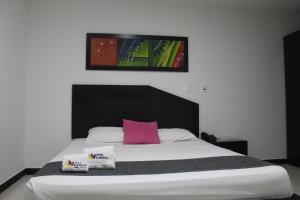 Postel nebo postele na pokoji v ubytování Hotel Cafeira