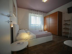Postel nebo postele na pokoji v ubytování B&b Angolo 29 + 19 fotografií