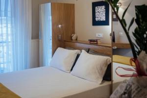 Postel nebo postele na pokoji v ubytování Leto Nuevo Hotel