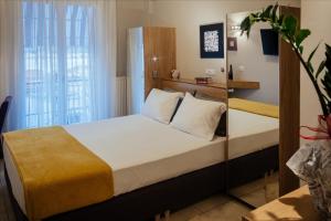 Postel nebo postele na pokoji v ubytování Leto Nuevo Hotel