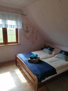 Postel nebo postele na pokoji v ubytování Domki Magnati
