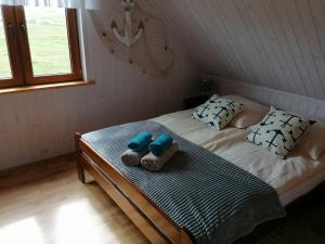 Postel nebo postele na pokoji v ubytování Domki Magnati