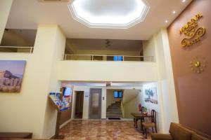 a living room with a skylight in the ceiling at Hotel Marina in Athens