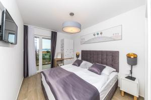 Postel nebo postele na pokoji v ubytování Villa Nia