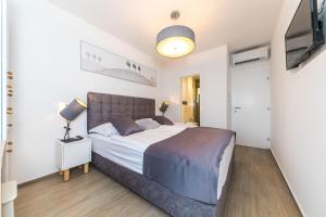 Postel nebo postele na pokoji v ubytování Villa Nia