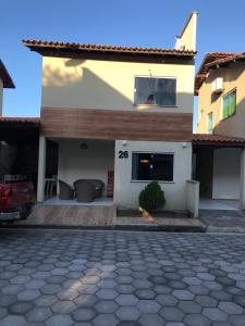 a house with a driveway in front of it at LENÇOIS VILLE RESIDENCE in Barreirinhas