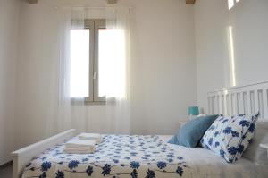 A bed or beds in a room at La Silvana B&B