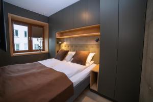 Postel nebo postele na pokoji v ubytování Home Again Apartments Kirkegata
