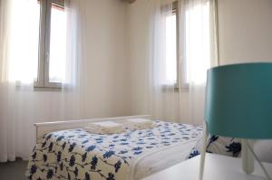 A bed or beds in a room at La Silvana B&B