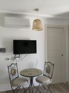 A television and/or entertainment centre at Oltre le Dune