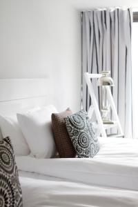 Ένα ή περισσότερα κρεβάτια σε δωμάτιο στο Hotel Fabian
