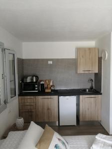 A kitchen or kitchenette at Oltre le Dune