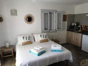 A bed or beds in a room at Oltre le Dune