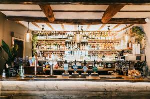 a bar with a lot of liquor bottles at The Old Bakery in Kenilworth