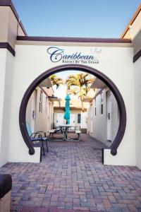 an archway leading to a patio in a building at Caribbean Resort by the Ocean in Hollywood