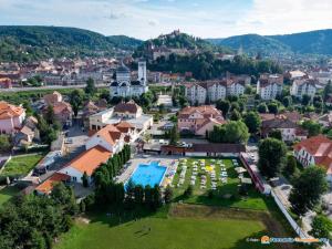 an aerial view of a town with a swimming pool at Pension Aquaris in Sighişoara