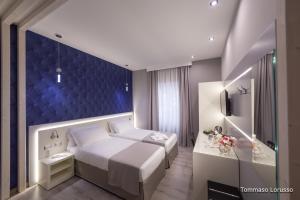 A bed or beds in a room at HOLYGOLD Suite ****