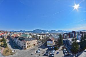 an aerial view of a city with cars parked at Hotel Europa in Liptovský Mikuláš