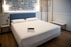 Postel nebo postele na pokoji v ubytování Hotel Palace