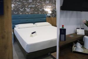 Postel nebo postele na pokoji v ubytování Hotel Palace