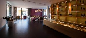 a large room with a wine store with wine bottles at Heitlinger Hof in Tiefenbach