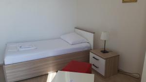 Postel nebo postele na pokoji v ubytování Apartmani Lara