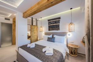 Ένα ή περισσότερα κρεβάτια σε δωμάτιο στο Bohemia Luxury Living