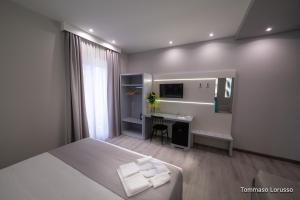 A bed or beds in a room at HOLYGOLD Suite ****