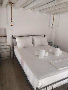 Postel nebo postele na pokoji v ubytování Melikarou houses