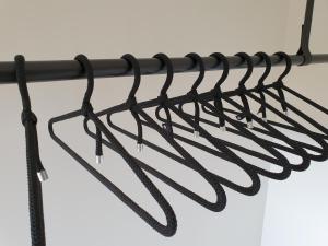 a bunch of utensils hanging on a rack at B&B Antares in Bruges