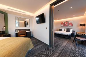 Postel nebo postele na pokoji v ubytování Marlin Hotel Stephens Green