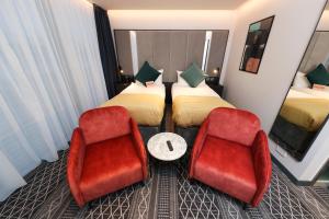 Postel nebo postele na pokoji v ubytování Marlin Hotel Stephens Green