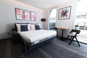 Postel nebo postele na pokoji v ubytování Marlin Hotel Stephens Green