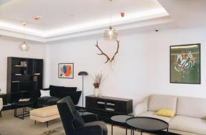 a living room with a couch and chairs at Imperia Apartments in Vrnjačka Banja